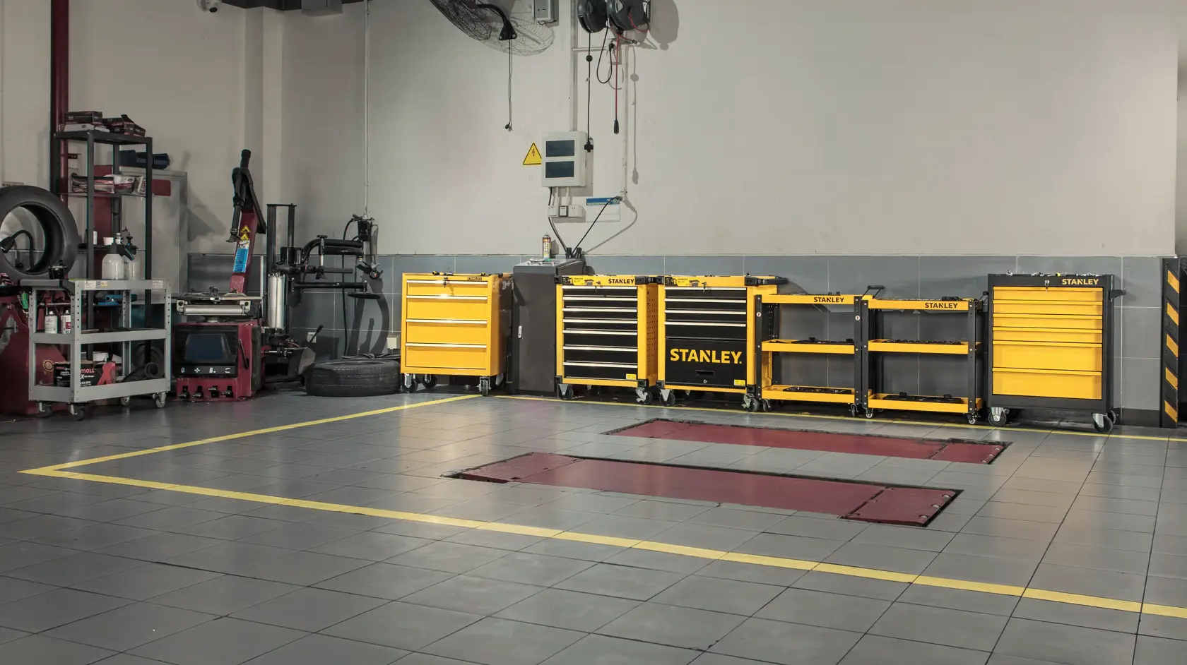 STANLEY STST74322-8 yellow tool cabinets in a garage workshop, shown from the front.