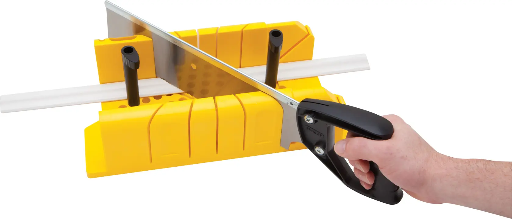 STANLEY 20-600 hand saw cutting white molding in yellow miter box, side angle, on white background.