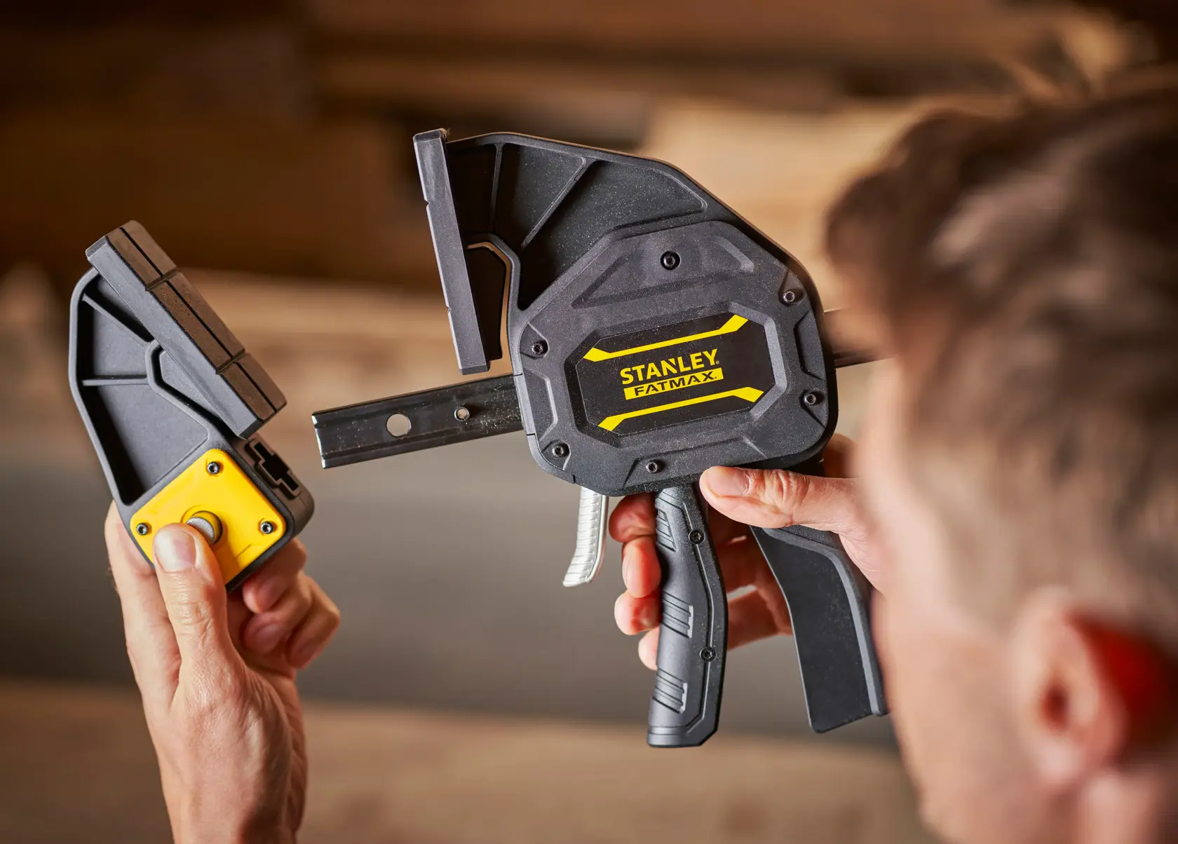 Photo of STANLEY FMHT0-83239 heavy-duty clamp in use, close-up view showing tool and detachable part.