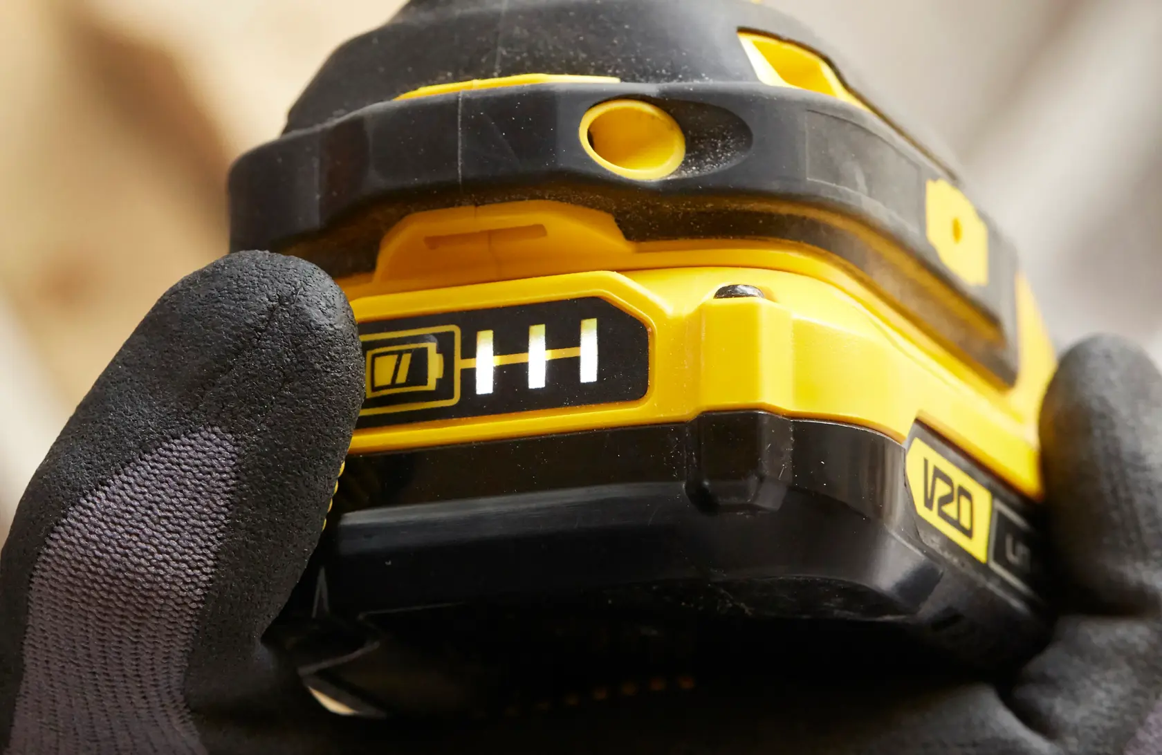 Photo of STANLEY SFMCF820B power tool showing yellow and black battery indicator, close-up angle.