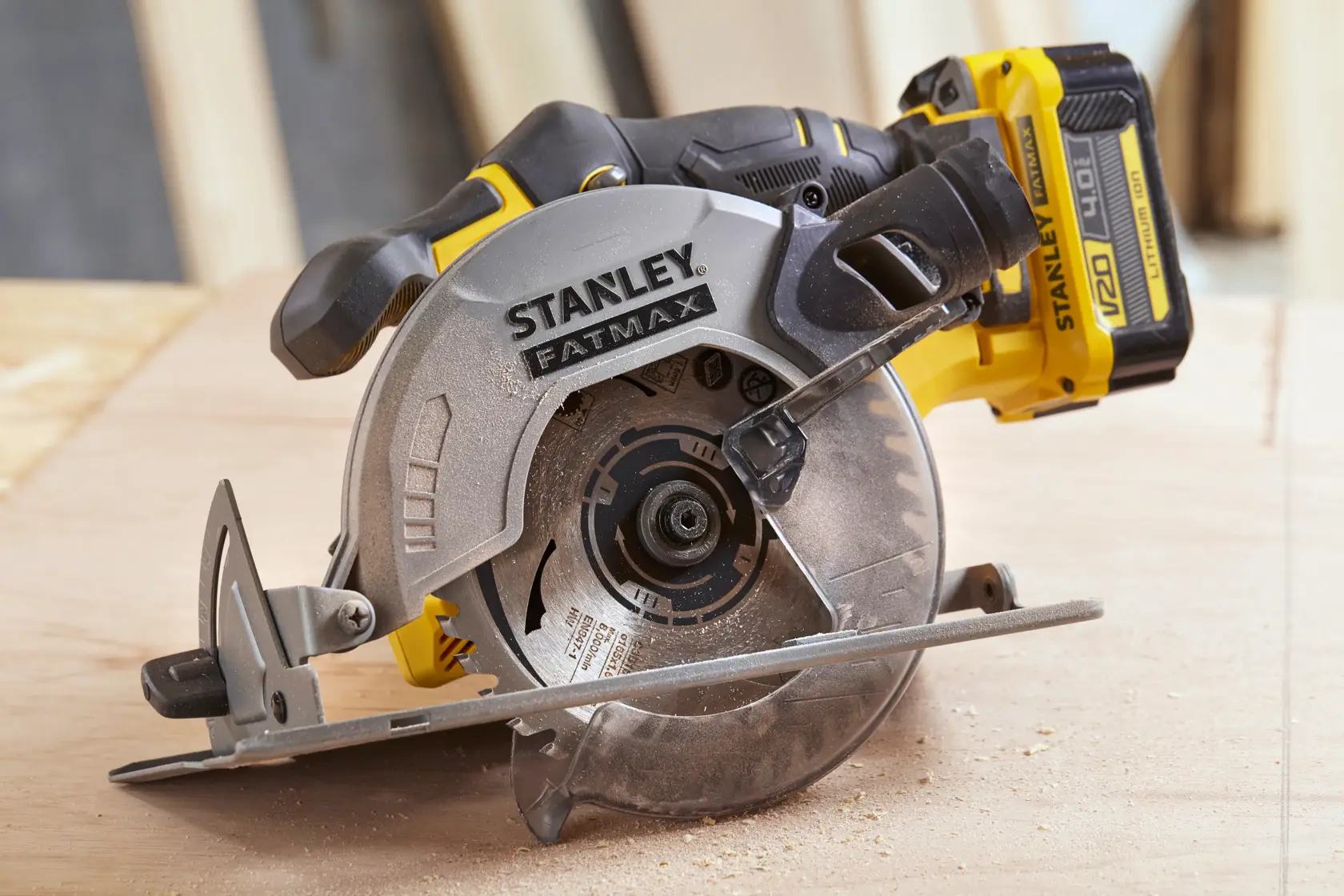 STANLEY SFMCS500M1S cordless circular saw side view on wood surface.