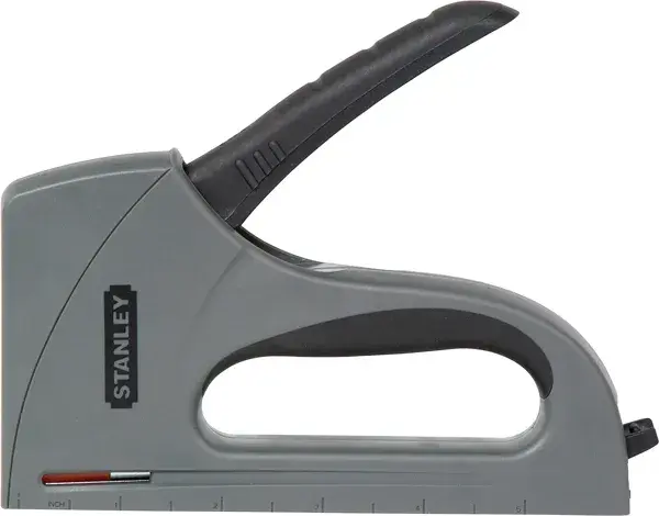 Photo of STANLEY TR40 heavy-duty staple gun, gray and black, side view, product on white background.